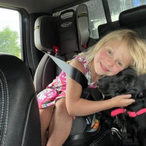 daughter-snuggling-puppy